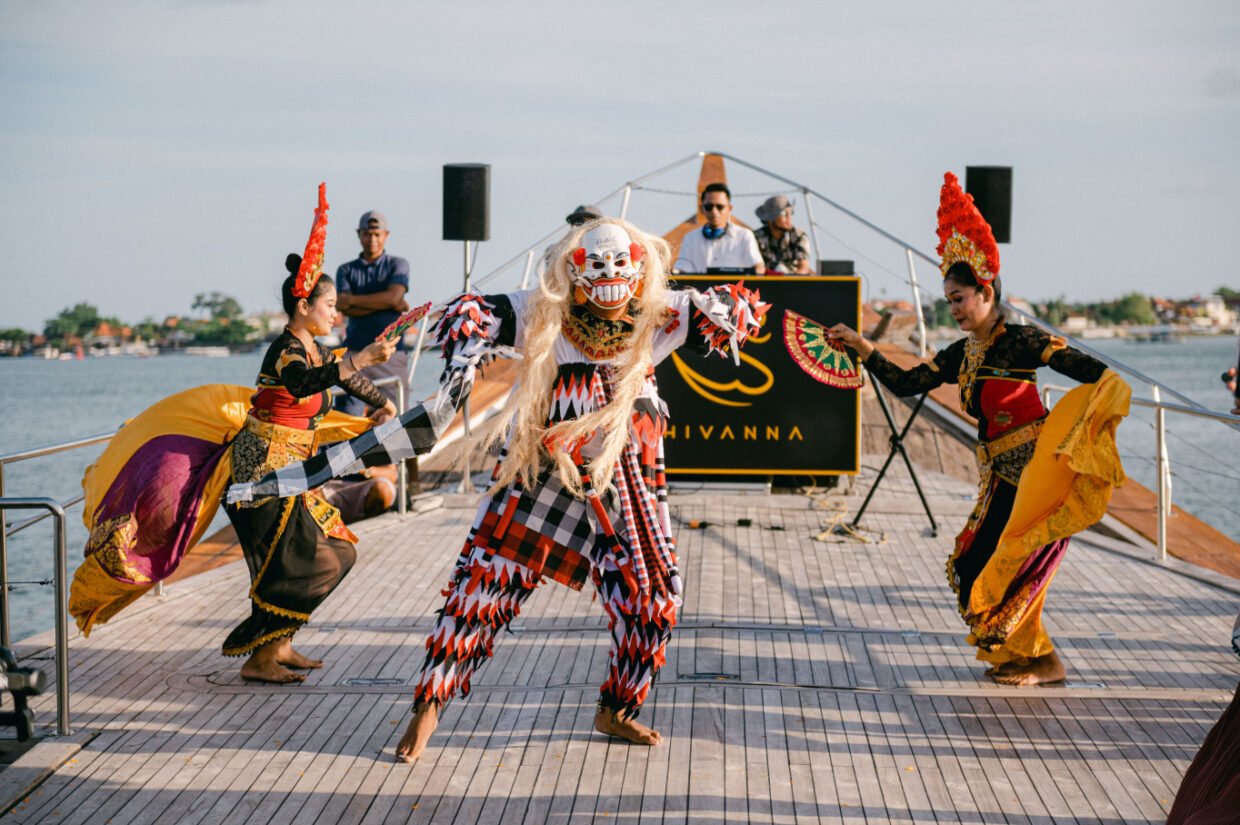 Balinese Rangda masked dancers performing on deck before the Shivanna stage backdrop