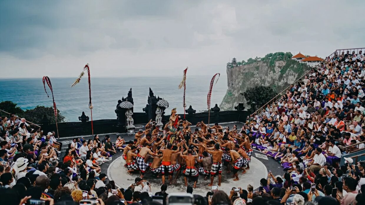 Kecak dance performance at a cliffside amphitheater overlooking the ocean