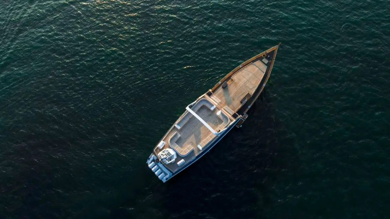 Aerial view of Shivanna boat on blue ocean water.