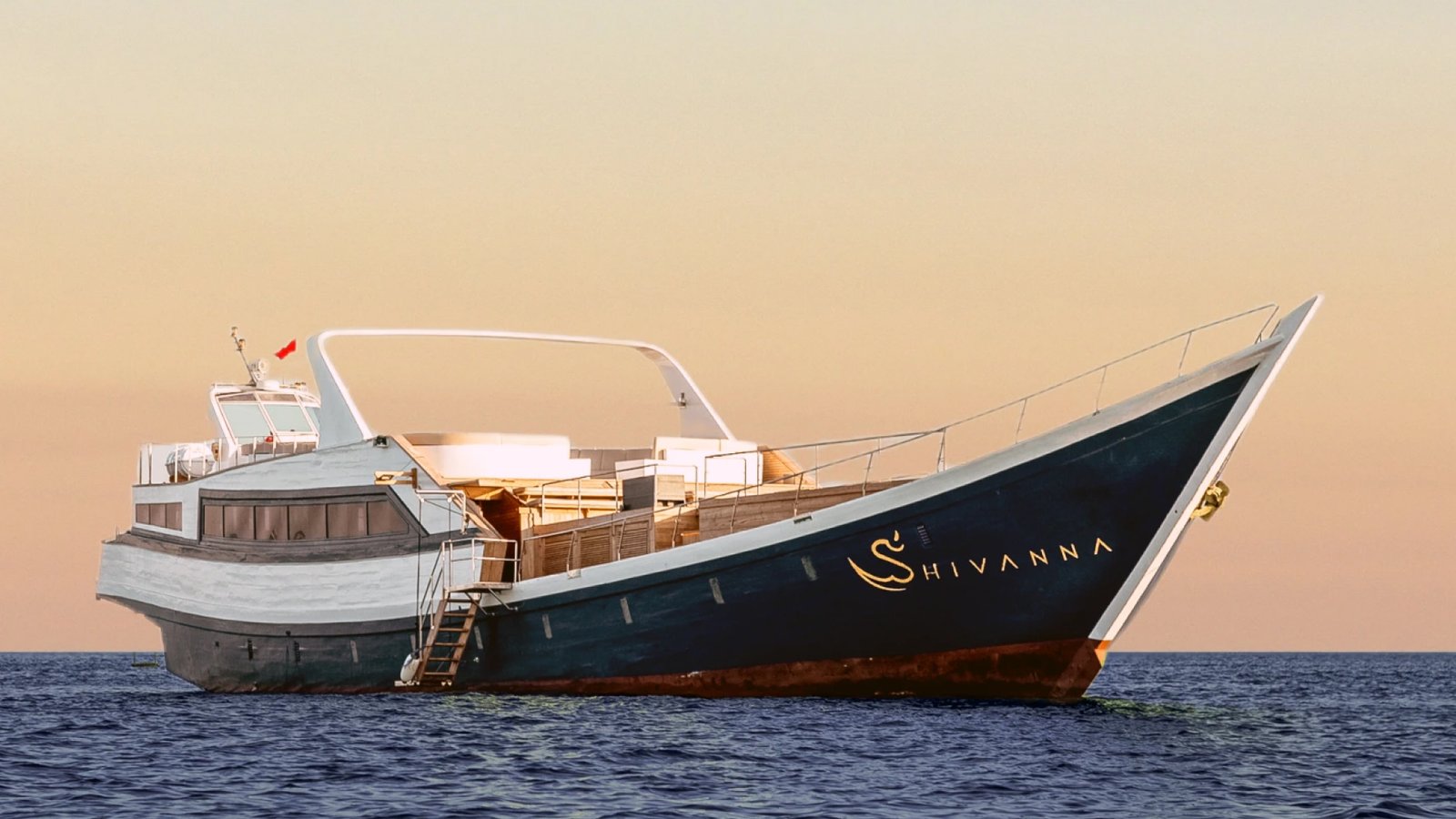 Yacht sailing in Bali during sunset.