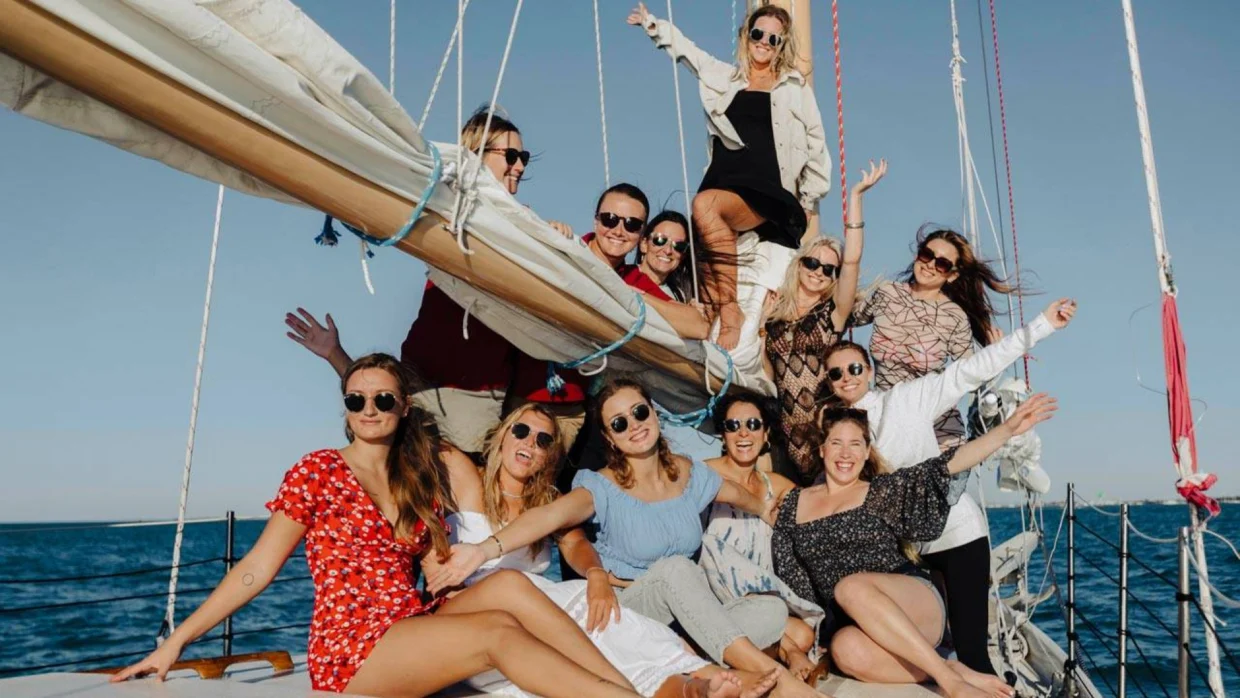 Group of friends enjoying a yacht trip
