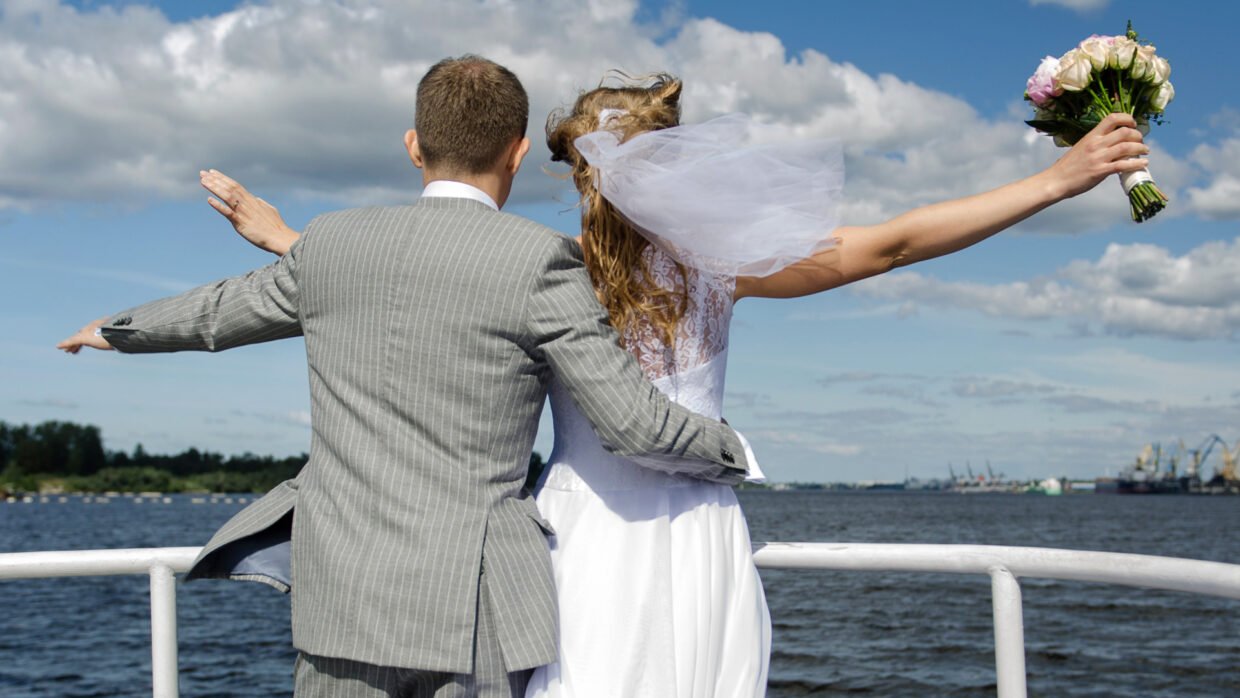 Wedding couple enjoying a yacht cruise
